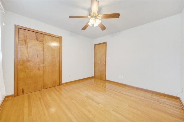 2422 Kingston Rd NW, Roanoke, VA 24017 - unfurnished bedroom with light wood finished floors, a closet, and a ceiling fan