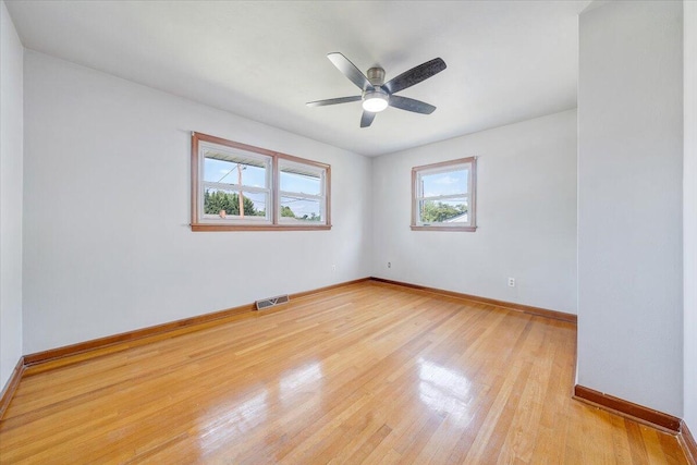 2422 Kingston Rd NW, Roanoke, VA 24017 - empty room featuring light wood finished floors and a ceiling fan
