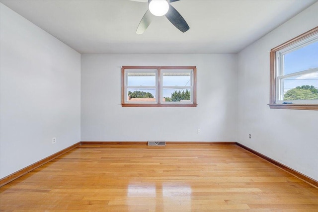 2422 Kingston Rd NW, Roanoke, VA 24017 - spare room with light wood finished floors and a ceiling fan