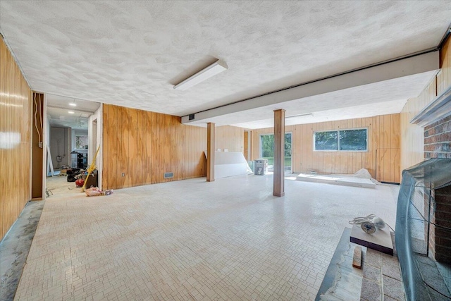 2422 Kingston Rd NW, Roanoke, VA 24017 - below grade area featuring wooden walls and a textured ceiling