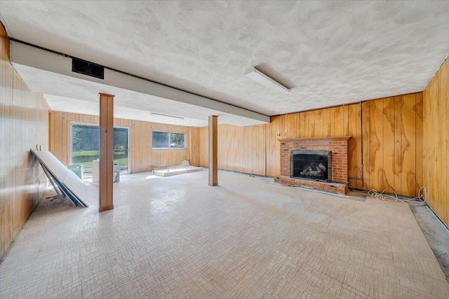 2422 Kingston Rd NW, Roanoke, VA 24017 - unfurnished living room with wooden walls and a brick fireplace