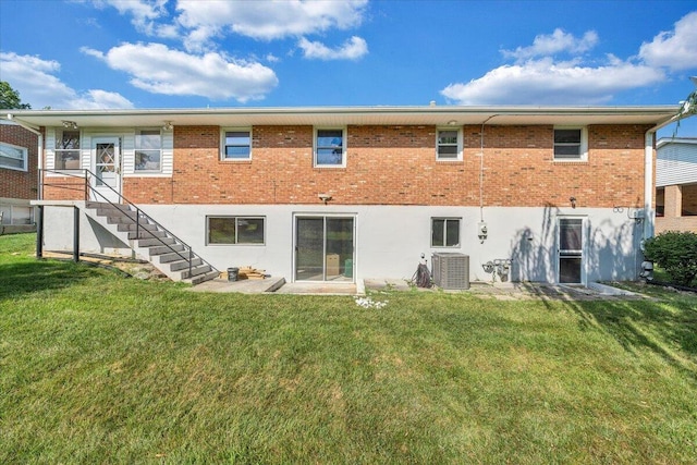 2422 Kingston Rd NW, Roanoke, VA 24017 - rear view of house with a lawn, brick siding, and stairway