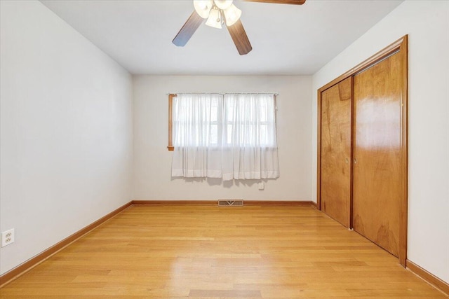 2422 Kingston Rd NW, Roanoke, VA 24017 - unfurnished bedroom with light wood-style floors, a closet, and a ceiling fan