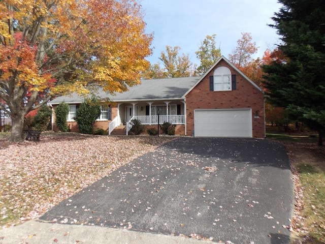 view of front of home with covered porch and a garage