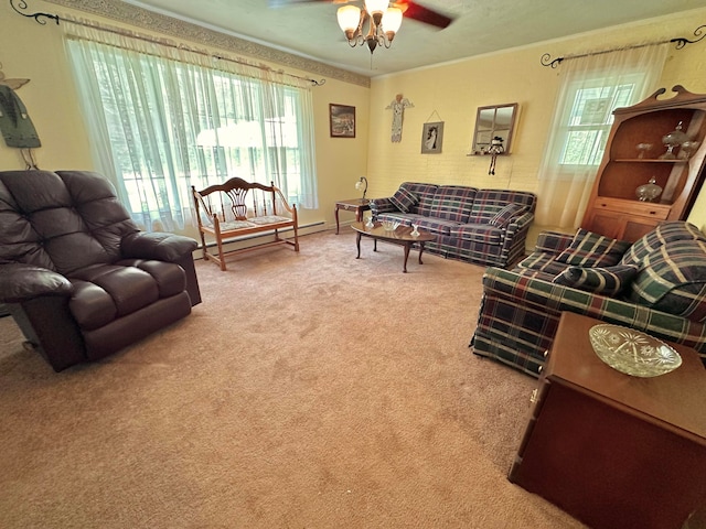 living room featuring carpet floors, a wealth of natural light, ceiling fan, and a baseboard radiator