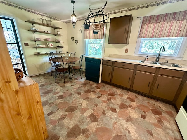 kitchen with dishwasher, dark brown cabinetry, decorative light fixtures, and sink