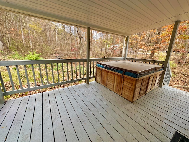 deck featuring a hot tub