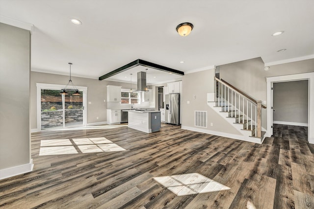 1154 Barrow Hills Dr, Huddleston, VA 24104 - unfurnished living room with healthy amount of natural light, dark wood-style flooring, baseboards, recessed lighting, and crown molding