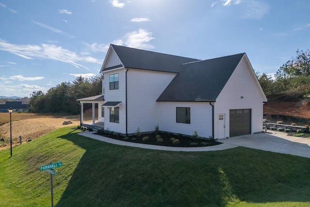 1154 Barrow Hills Dr, Huddleston, VA 24104 - view of property exterior featuring concrete driveway, a garage, a yard, and a shingled roof