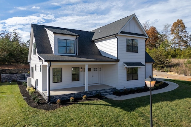 1154 Barrow Hills Dr, Huddleston, VA 24104 - modern farmhouse style home with a porch, a front yard, and roof with shingles