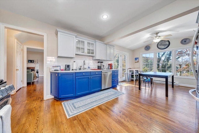 kitchen with blue cabinetry, white cabinetry, ceiling fan, tasteful backsplash, and stainless steel dishwasher