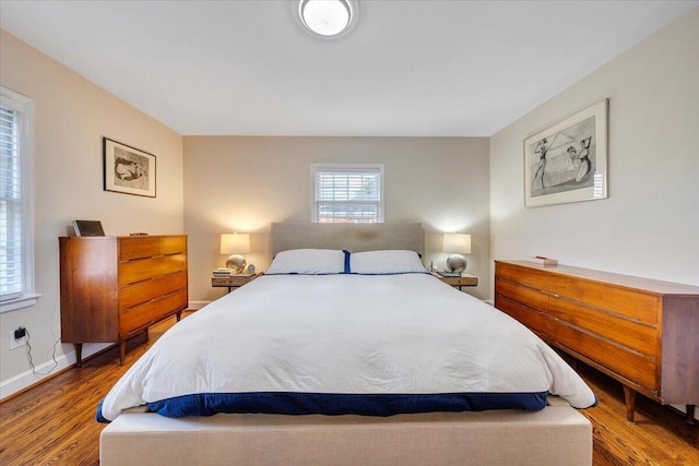 bedroom with hardwood / wood-style flooring