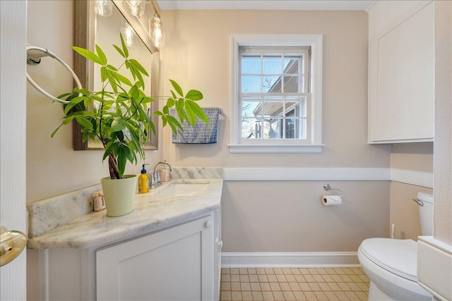 bathroom featuring vanity and toilet