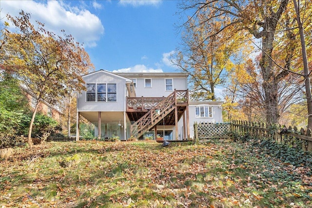 back of property with a wooden deck