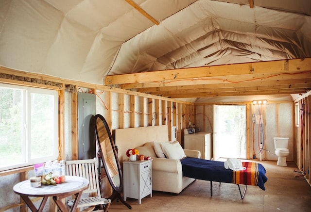 interior space featuring washing machine and dryer and vaulted ceiling