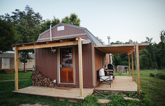 view of outbuilding with a lawn