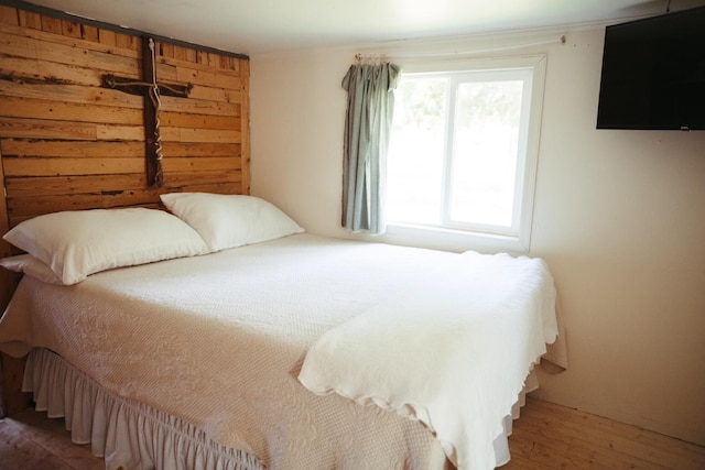 bedroom with hardwood / wood-style flooring