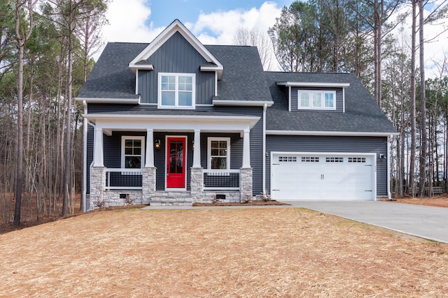 craftsman inspired home with a garage and a porch