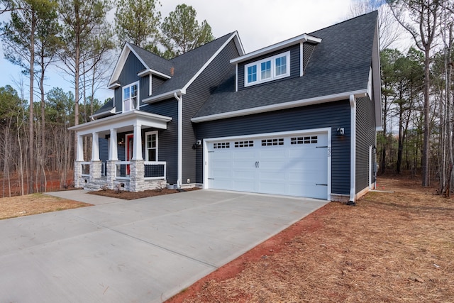 craftsman-style home featuring a porch and a garage