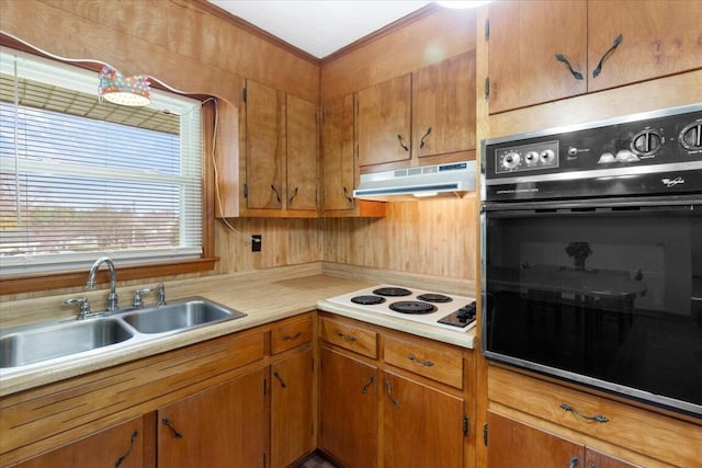 kitchen featuring black oven, crown molding, sink, and white electric stovetop