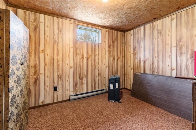 interior space featuring baseboard heating, wooden walls, and carpet