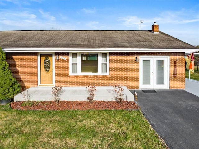 exterior space with a yard and french doors