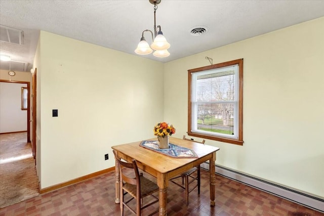 dining area featuring baseboard heating, an inviting chandelier, a textured ceiling, and dark colored carpet