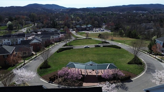 birds eye view of property with a mountain view