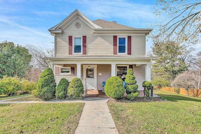 front facade featuring a front lawn and a porch