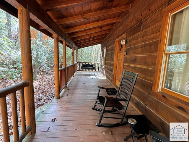 wooden terrace with covered porch