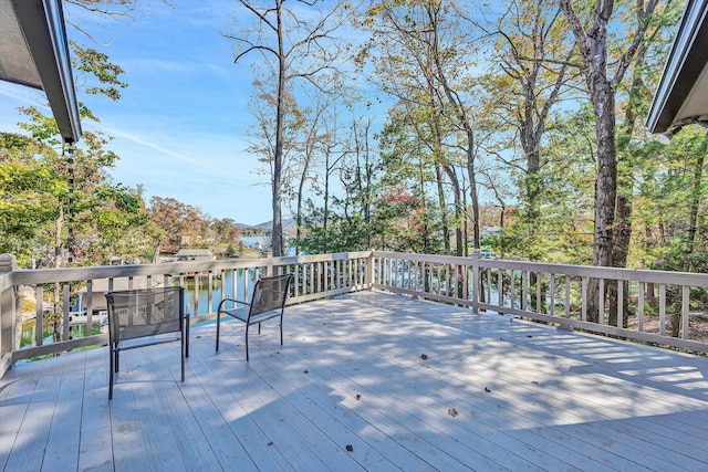 wooden deck featuring a water view