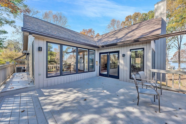 back of property featuring a wooden deck