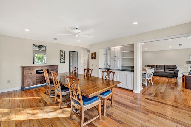 dining area featuring ceiling fan and light hardwood / wood-style floors