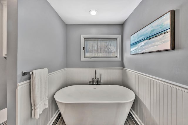 bathroom with a tub to relax in