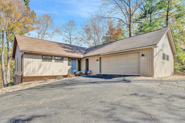 ranch-style house featuring a garage