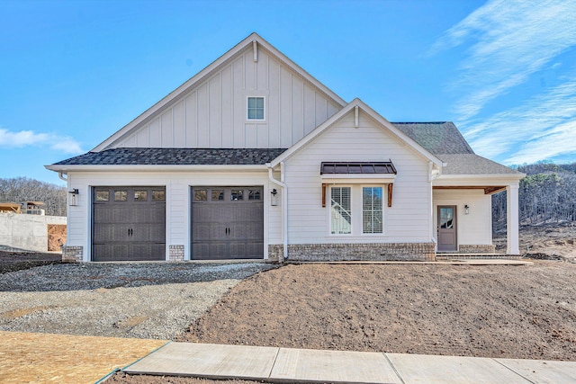 modern farmhouse style home featuring a garage