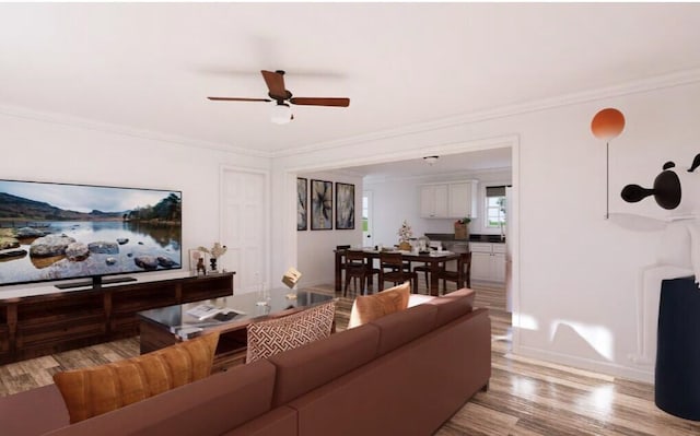 living room with ceiling fan, light wood-type flooring, and ornamental molding