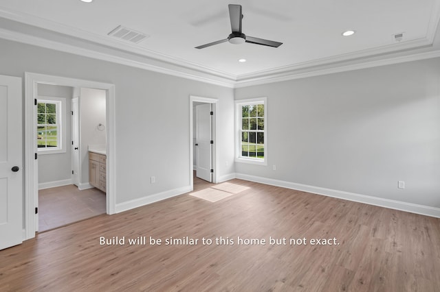 unfurnished bedroom with baseboards, ornamental molding, visible vents, and light wood-style floors