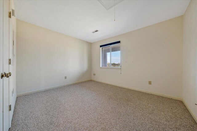 unfurnished bedroom with two closets and light colored carpet