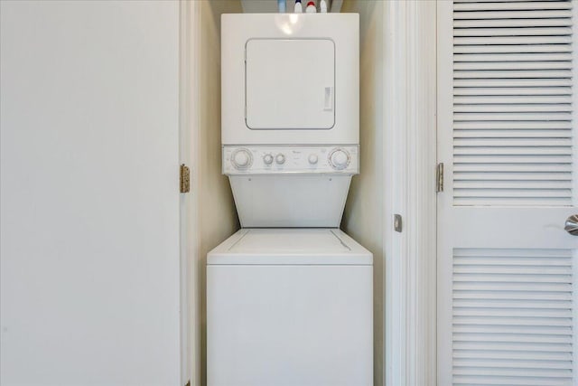 laundry area featuring laundry area and stacked washing maching and dryer