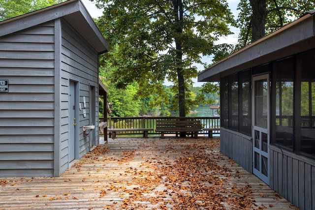 wooden deck featuring a sunroom