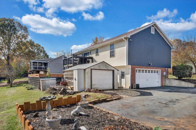 100 Surber Dr, Moneta, VA 24121 - view of property exterior with brick siding, a yard, and asphalt driveway