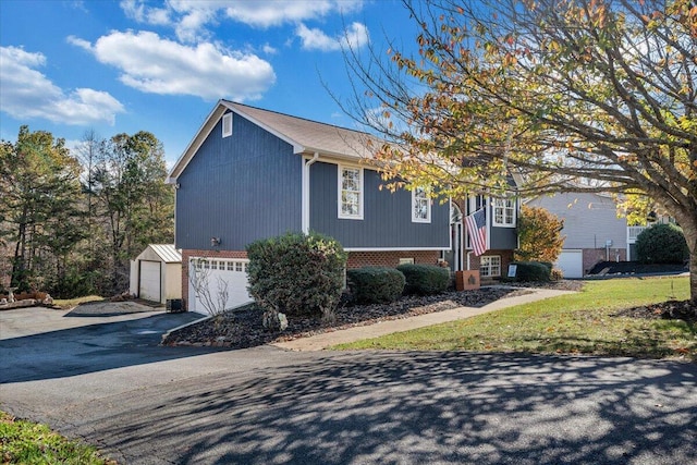 100 Surber Dr, Moneta, VA 24121 - view of front facade featuring a garage, brick siding, and driveway