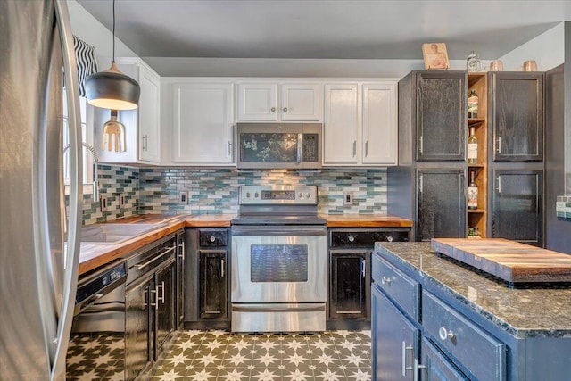 kitchen with light floors, open shelves, stainless steel appliances, decorative backsplash, and white cabinetry