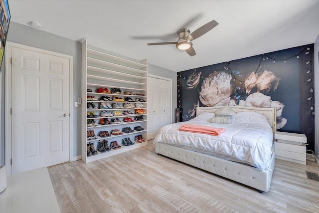 bedroom featuring ceiling fan and wood finished floors