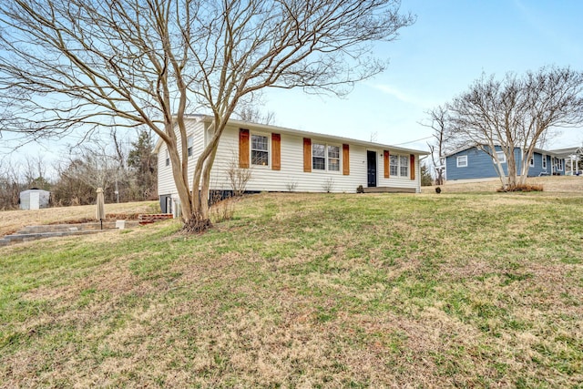 ranch-style house featuring a front lawn