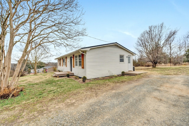 view of property exterior featuring a deck