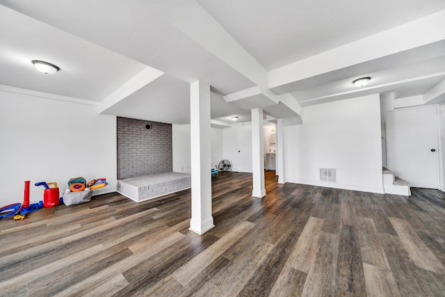 basement featuring dark hardwood / wood-style flooring