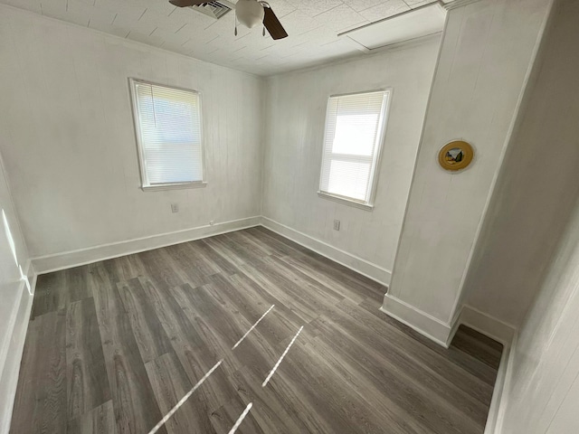 unfurnished room with ceiling fan and dark hardwood / wood-style flooring