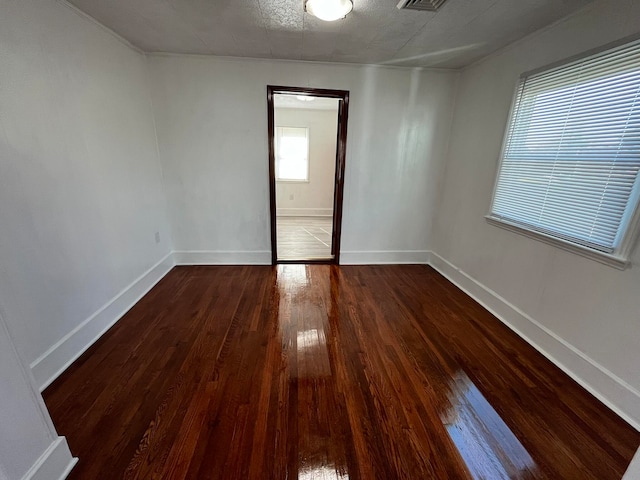 empty room featuring dark hardwood / wood-style floors